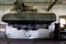 This was the kitchen area. The artist used the venting hood as material depicting a bottom of a boat. The ship appears as if it was upsidedown in the water. It reads: Ellis Island - Immigration Service