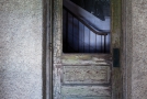 view of stairway through wooden door