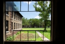 View of outside grounds through broken panes
