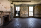Large room with fireplace. Image taken from doorway there was no admittance to that area