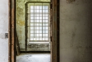 Notice the window is caged. Possibly a room for a psychiatric immigrant