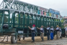 2o6a1453 Gate staff awaiting the arrival of the horse and jockeys. This is one of the most dangerous jobs at the track.